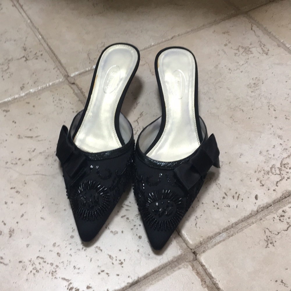 Dressy with black bow and sequins.